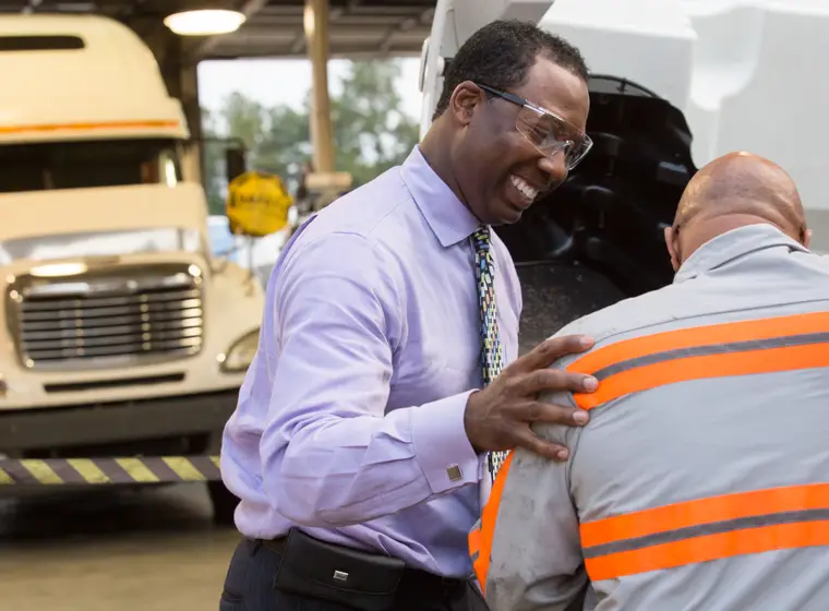 Supervisor talking to worker