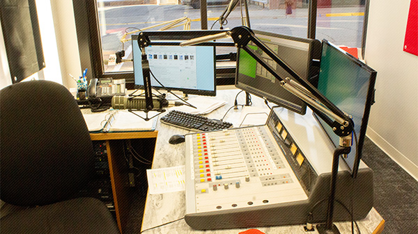 Studio room filled with radio equipment at KIOW radio station