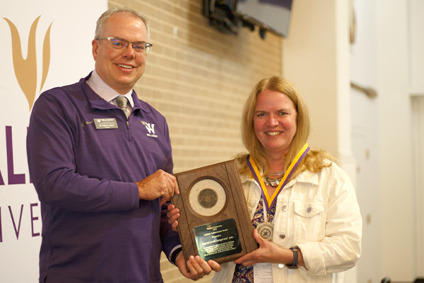 President Bob Alsop presenting Alumnus Ingrid Gangestad the Waldorf Lifetime Achievement Award 